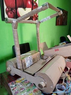 a table topped with lots of different types of crafts and paper machs on top of it