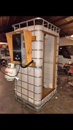 a large white tank sitting inside of a garage