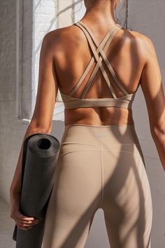 Beige sports bra and tights from ICANIWILL. Sports bra has a strappy back and tights are high waisted. Aura Photoshoot, Babylon Club, 5 Day Workout Routine, Pilates Poses, Yoga Photoshoot, Yoga Aesthetic, Yoga Branding, Yoga Pictures, Fitness Style