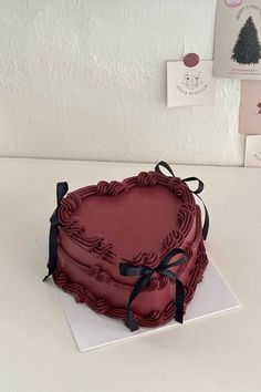 a heart shaped cake on a white table