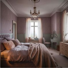 a bedroom with purple walls and white trim on the ceiling, bedding is made up