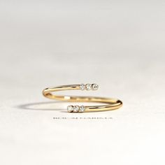 two diamond rings sitting on top of each other