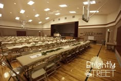 an empty conference room with tables and chairs