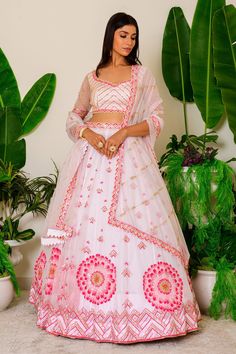 Icy pink lehenga with beads and sequin embroidery. Comes with embroidered blouse and dupatta.
Component: 3
Pattern: Embroidery
Type Of Work: Sequin and Beads
Neckline: Leaf
Sleeve Type: Half
Fabric: Organza
Color: Pink
Other Details: 
Cutwork detail on the hems
Embroidered dupatta with cutwork border
Cutout at the back with tie up
Closure: Back hook
Occasion: Wedding - Aza Fashions Anarkali Pink Embroidered Choli, Pink Mirror Work Traditional Wear For Reception, Pink Traditional Wear With Mirror Work For Reception, Pink Embroidered Bollywood Choli, Pink Embroidered Fabric With Pallu For Reception, Pink Bollywood Embroidered Choli, Pink Embroidered Fabric With Mirror Work, Fitted, Fitted Pink Embroidered Fabric With Mirror Work, Pink Fitted Embroidered Fabric With Mirror Work