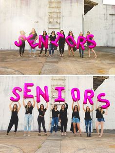 some girls are holding up pink letters in front of a white building and one girl is posing for the camera