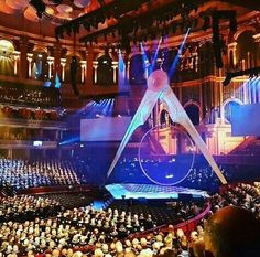 an auditorium filled with people and lights