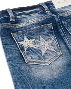 Mid-rise, medium dark-wash girls straight jeans- Silver and white embroidered stars throughout front and back design- Classic back pocket with matching motif- Embossed white leather Miss Me brand patch- Frayed bottom hems- Fading with whiskering details- 5-pocket design Measurements: USA WAIST HIP FRONT RISE X BACK RISE 7 23 3/4 28 3/4 7 1/4 X 11 3/4 8 24 1/2 29 1/2 7 1/2 X 12 10 25 1/2 30 1/2 7 3/4 X 12 1/4 12 26 1/2 31 1/2 8 X 12 1/2 14 27 1/2 32 1/2 8 1/4 X 12 3/4 16 28 1/2 33 1/2 8 1/2 X 13 Thrift Flips, Embroidered Stars, Stylish Girl, Miss Me, Pocket Design, Jeans Shop, Straight Jeans, White Leather, All Star