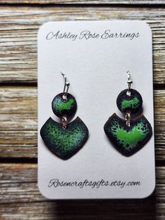 Abstract Shapes Black and Green; unique one of a kind enameled earrings. All products include exchange of equal or lesser value if in 30 days of purchase if front glass chips away noticeably showing copper.  Send me a picture of the earrings and your contact information. Modern Green Hand Painted Copper Jewelry, Modern Hand Painted Green Copper Jewelry, Hand Painted Green Copper Jewelry, Green Hand Painted Copper Earrings, Green Enamel Earrings With Artistic Design, Modern Green Glass Earrings, Artisan Green Enamel Earrings, Enameled Earrings, Bohemian Green Enamel Earrings