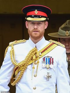 a man in uniform standing next to another man