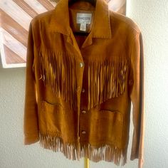 Gorgeous Light Brown Chicos Western Suede Jacket With Tassels 100 Leather, Two Pockets At Front Cute Silver Buttons With Lizards. In Excellent Condition No Stains Or Rips. P2p 19” Length 23” Light Weight And Perfect For Fall & Concerts Jacket With Tassels, Brown Fringe Outerwear For Winter, Tassel Jacket, Luxury Single-breasted Suede Outerwear, Vintage Brown Fringed Outerwear, Brown Long-sleeve Fringe Outerwear, Suede Fringe Jacket, Silver Buttons, Suede Jacket