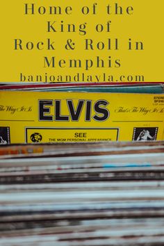 a stack of records sitting on top of each other next to a yellow sign that says elvis