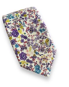 "This purple lilac floral necktie, and bowtie are perfect for any special occasion.  The regular necktie is 3.5 inches wide and 59 inches long.  The skinny necktie is 2.5 inches wide and 59\" long." Purple Spring Formal Tie, Multicolor Suit And Tie Accessories For Spring Formal, Multicolor Suit And Tie Accessories For Formal Spring Events, Purple Standard Tie For Gift, Elegant Multicolor Ties For Spring, Elegant Spring Bow Tie For Gift, Elegant Spring Bow Tie As A Gift, Classic Floral Print Tie For Gift, Classic Floral Print Tie As A Gift