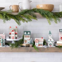 a shelf with christmas decorations on top of it and other items in front of the shelves