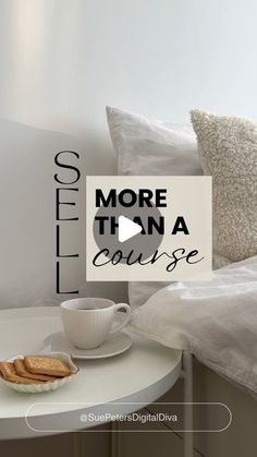 a cup of coffee on a table next to a pillow and some pillows with the words more than a course