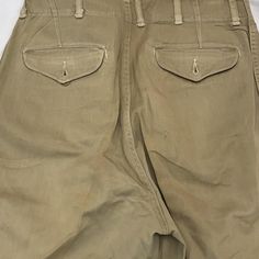 Vintage military work wear pants 1930-60s size: waist - 28” inseam-32” Military Style Straight Khaki Bottoms, Military Style Straight Khaki Pants, Military Style Khaki Straight Pants, Military Style Khaki Wide Leg Bottoms, Military Style Wide Leg Khaki Bottoms, Khaki Military Straight Pants, Vintage Wide-leg Cargo Jeans, Military Style High-waist Bottoms With Belt Loops, Military Style High Waist Khaki Pants