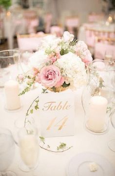 a table with flowers and candles is set up for a wedding reception at the hotel