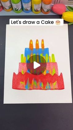 an image of a cake with crayons on it and the caption let's draw a cake