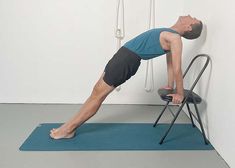 a man is doing exercises on a chair