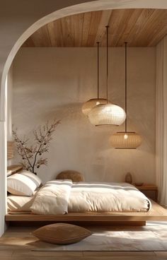 a bed sitting in a bedroom next to a wooden table and lamp shade hanging from the ceiling