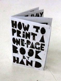 a book with the title how to print a one - page book by hand written on it