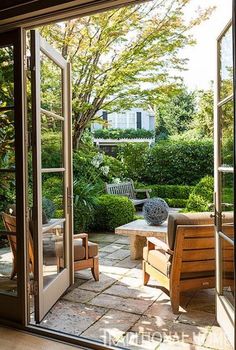 an open patio door leading to a sitting area