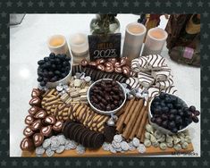 a table topped with lots of different types of food and drinks on top of it