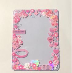 a mirror with pink flowers and hearts on the bottom, surrounded by other stickers