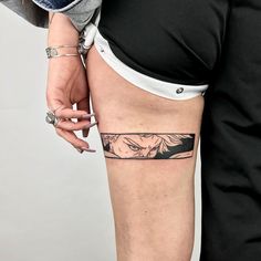 a woman's leg with a tattoo on it and the bottom part of her thigh