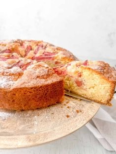 a cake on a plate with a slice missing from it