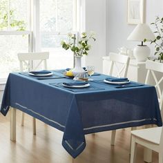 a blue table cloth on a dining room table