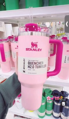 the pink tumbler cup is on display for sale