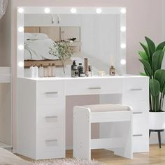 a white vanity and stool with lights on it