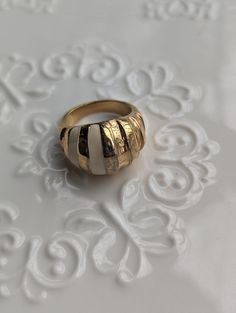 This beautiful statement is circa early 60s. It is gold plated croissant style ring with a white enamel stripe. I love this vintage but trendy piece that can be worn casually or out to a cocktail night with the girls.  This versatile piece is timeless yet trendy while being a unique ring to treasure for years to come. Formal White Enamel Rings, White Elegant Enamel Rings, White Enamel Elegant Rings, Elegant White Enamel Rings, Retro White Jewelry For Anniversary, White Retro Jewelry For Anniversary, Vintage White Rings For Anniversary, Retro White Enamel Jewelry, White Retro Enamel Jewelry