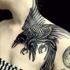 a woman with a bird tattoo on her chest