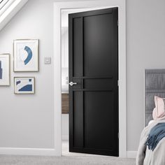 an open door to a bedroom with white walls and carpeted flooring is shown