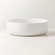 a white bowl sitting on top of a table