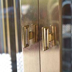 a close up view of the handles on a metal door