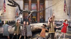 children are dancing in front of a dinosaur skeleton