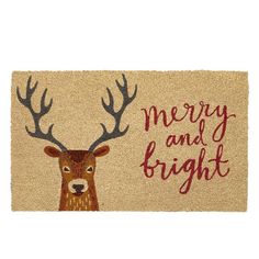 a merry and bright door mat with a deer's head on the front side