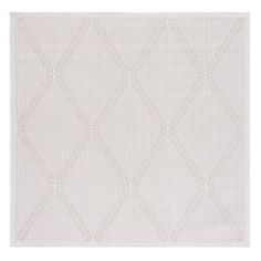 a white rug with diamond shapes on it