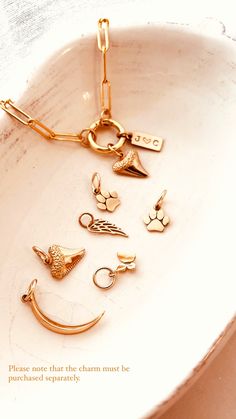 Mix and match your favorite pendant charms to create a personalized piece of jewelry. Each charm is sold separately and individually. Item Details:This is a listing for ONE(1) Gold Charm. ( Including a 14k gold-filled jumping 7mm ) Tiny Butterfly Charm, Natural Bronze, 10mm.Paw Charm, Natural Bronze, 9mm.Shark Tooth Charm, Natural Bronze, 11mm.Wing Charm, Natural Bronze, 15mmCrescent Moon charm Natural Bronze, 22 mm *Natural Bronze - Our bronze is a high-quality Italian copper and tin alloy cont Tooth Charm, Tiny Butterfly, Shark Tooth, Shark Teeth, Moon Charm, Butterfly Charm, Gold Charm, Mix N Match, Free Giveaway