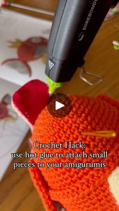 an orange crochet hat is being used to attach small pieces to your angigrumis