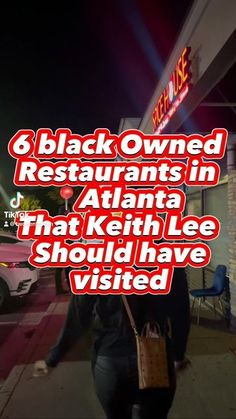 a woman is walking down the sidewalk in front of a restaurant with red lettering on it