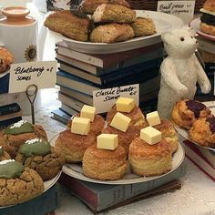 a table topped with lots of cakes and pastries