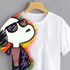 a white t - shirt with a cartoon character on the front and an image of a person wearing sunglasses