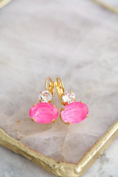 Vibrant Pink Crystal Earrings featuring electric neon pink drops, handmade with genuine Austrian crystals, are perfect as a standout gift for women and add a pop of color to any outfit! Details :  ● Materials- 14k Gold or Silver Plated over brass, Premium Quality Genuine Austrian Crystals. ● Lever-back style Earrings ● Size 26 mm x 14 mm  (1" x 0.55")  ● Color, Electric Neon Pink, White Clear Crystal ● Crystals - handset in secure prongs ● Nickel Free ● Bridal - Bridesmaid - Bulk Order Discounts Pink Earrings With Lever Back Ear Wires For Party, Pink Drop Earrings, Pink Crystal Earrings, Style Earrings, Austrian Crystal, Bulk Order, Pink Crystal, Outfit Details, Gift For Women