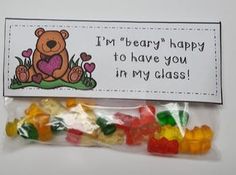 a bag of gummy bears sitting on top of a white table next to a sign that says, i'm beary happy to have you in my class