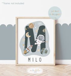 a poster with the letter m and an astronaut floating in space on it's side