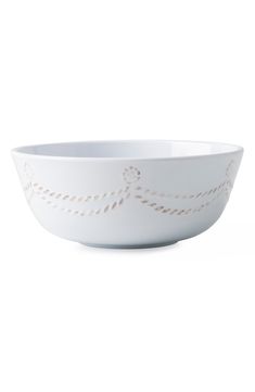 a white bowl with an ornate design on it