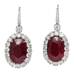 Spectacular Ruby and Diamond earrings!! 33.61 carats of impressive Ruby drops set with 10.06 carats of white round brilliant cut diamonds. Set in 18k white gold Natural rubies of this size and color are a rare find! The rubies are only heat treated, certified by GIA. Just under 2 inches long Made in New York Ruby And Diamond Earrings, Ruby And Diamond Necklace, Diamond Dangle Earrings, Ruby Earrings, Ruby Jewelry, Diamond Drop Earrings, White Gold Earrings, Diamond Drops, Fine Jewelry Designers